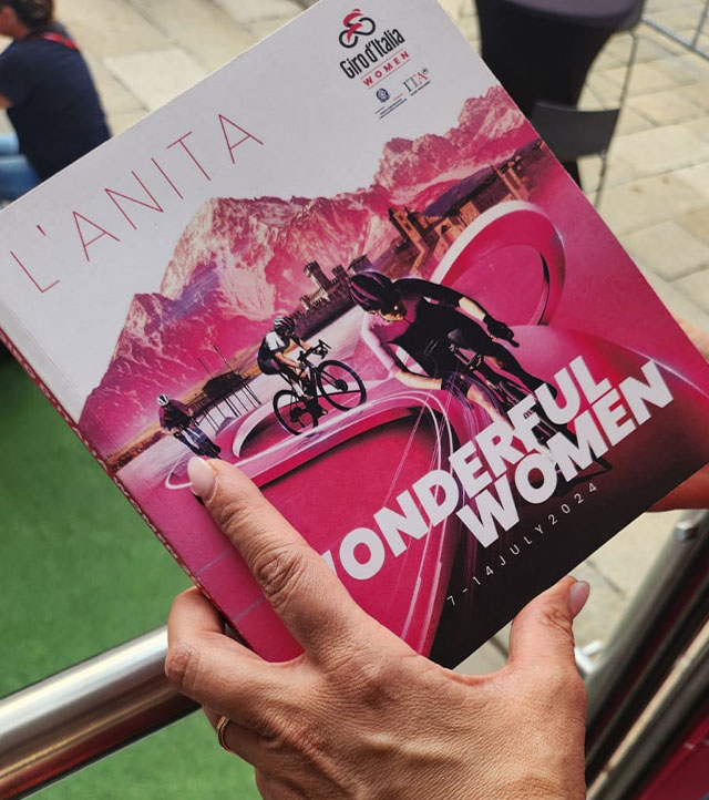 Francesca Polti holds in her hands the "L'Anita" roadbook of the Giro d'Italia 2024 entitled "Wonderful Women"